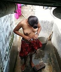 Indian woman on touching the shower